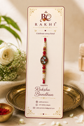 Premium Oval Kundan Stone Rakhi with Pearl Beads